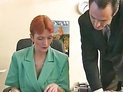Redheaded Older Secretary Sucks Boss's Cock At Her Desk